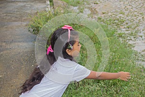 Cute little girl having fun at countryside.