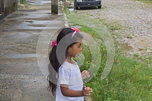 Cute little girl having fun at countryside.