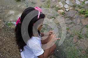 Cute little girl having fun at countryside.