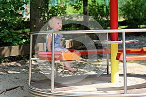 Cute little girl having fun at playground