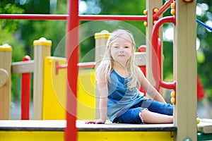 Cute little girl having fun on a playground