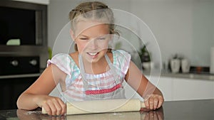 Cute Little Girl Helps Cooking. She`s the Mistress of the Kitchen. Cooking Brings Her A Lot Of Fun.