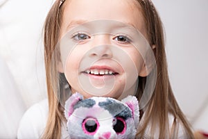 Cute little girl with her favourite stuffed toy