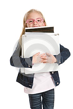 Cute little girl holding books isolated on white