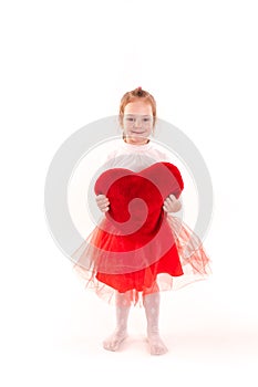 Cute little girl holding red heart isolated