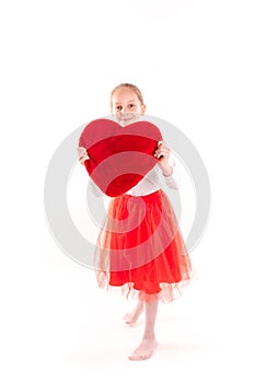 Cute little girl holding red heart isolated