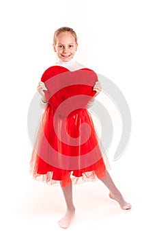 Cute little girl holding red heart isolated