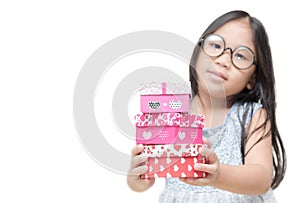 Cute little girl holding small red present box gifts