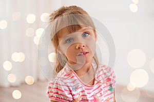 Cute little girl at home.