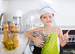 Cute little girl at home kitchen