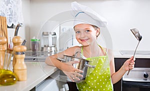 Cute little girl at home kitchen
