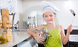 Cute little girl at home kitchen