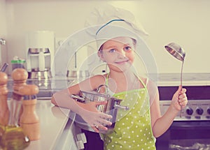 Cute little girl at home kitchen