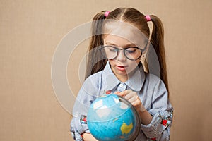 Cute little girl hugging globe. save the earth concept.