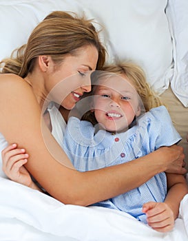 Cute little girl hugging with her mother