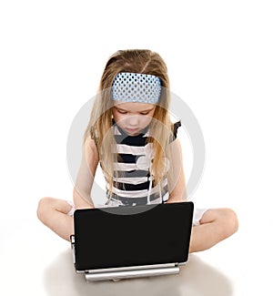 Cute little girl with laptop isolated