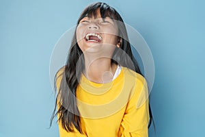 cute little girl laugh happy on blue photo