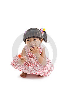 Cute little girl with a lollipop