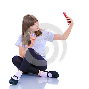 Cute little girl making selfie