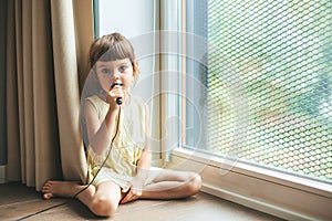 Cute little girl with microphone