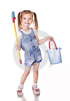 Cute little girl with mop and bucket is ready to clean