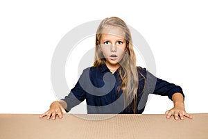 Cute little girl opening the biggest postal package