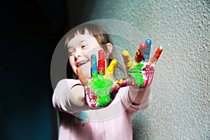 Cute little girl with painted hands