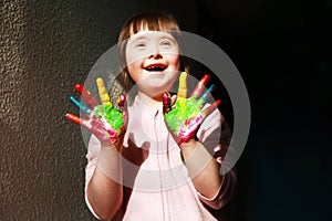 Cute little girl with painted hands