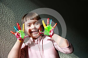 Cute little girl with painted hands