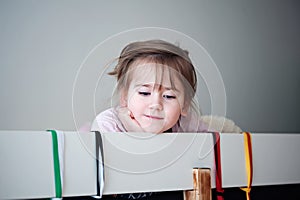 Cute little girl in pajama in a bed