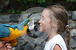 Cute little girl and parrot