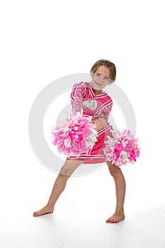 Cute little girl in pink cheering outfit