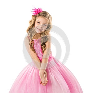 Cute little girl in pink princess dress, isolated on white background