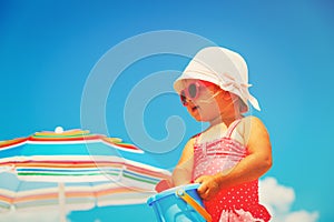 Cute little girl play at summer beach