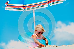 Cute little girl play at summer beach