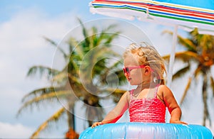 Cute little girl play at summer beach