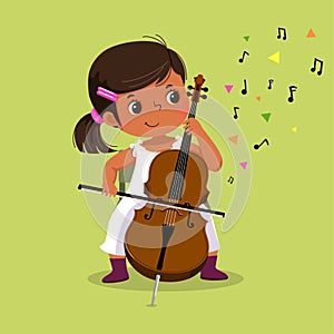 Cute little girl playing the cello on green background photo