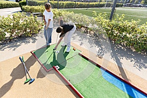 Cute little girl playing golf