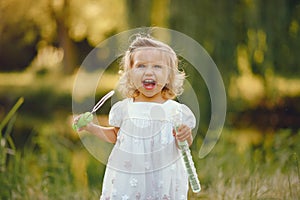 Cute little girl playing in a park