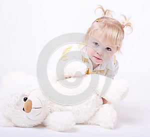 Cute little girl playing with teddybear