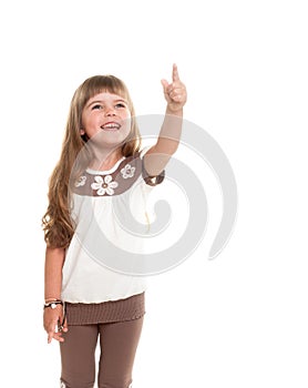 Cute little girl pointing up somewhere and smiling