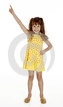 Cute Little Girl Pointing Upward photo