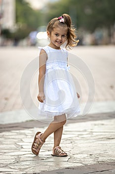 Cute little girl posing and smiling