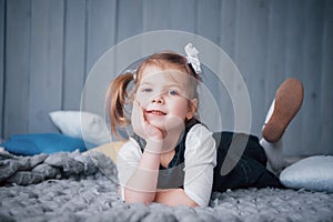 Cute little girl in a princess costume. Pretty child preparing for a costume party