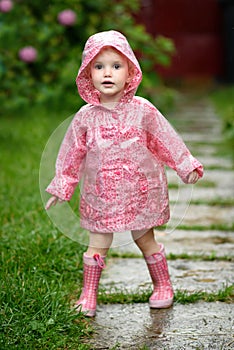 Cute little girl in the rain
