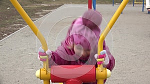 Cute Little Girl Running on Elliptical Trainer in the Open Air Gym. 4K UltraHD, UHD