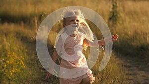 Cute little girl running at field