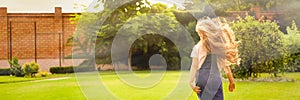 Cute little girl running in park. Banner design