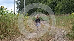 Cute Little Girl Running in Summer Country Road