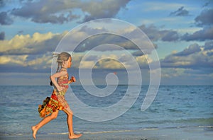 Cute little girl on sandy beach